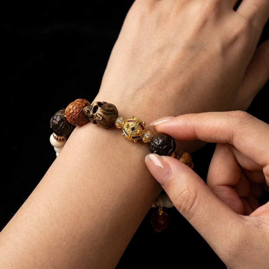 Person navigating the complex tactile textures of the Ancient Council skull bracelet on their wrist, using it as a physical tool to overcome decision fatigue.