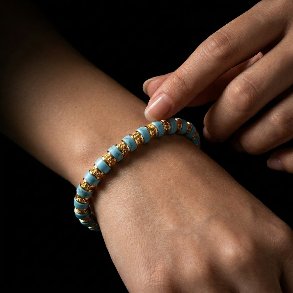 A person running their fingers across the ridged surface of the Turquoise focus bracelet, using the tactile feedback to break mental tunnel vision.