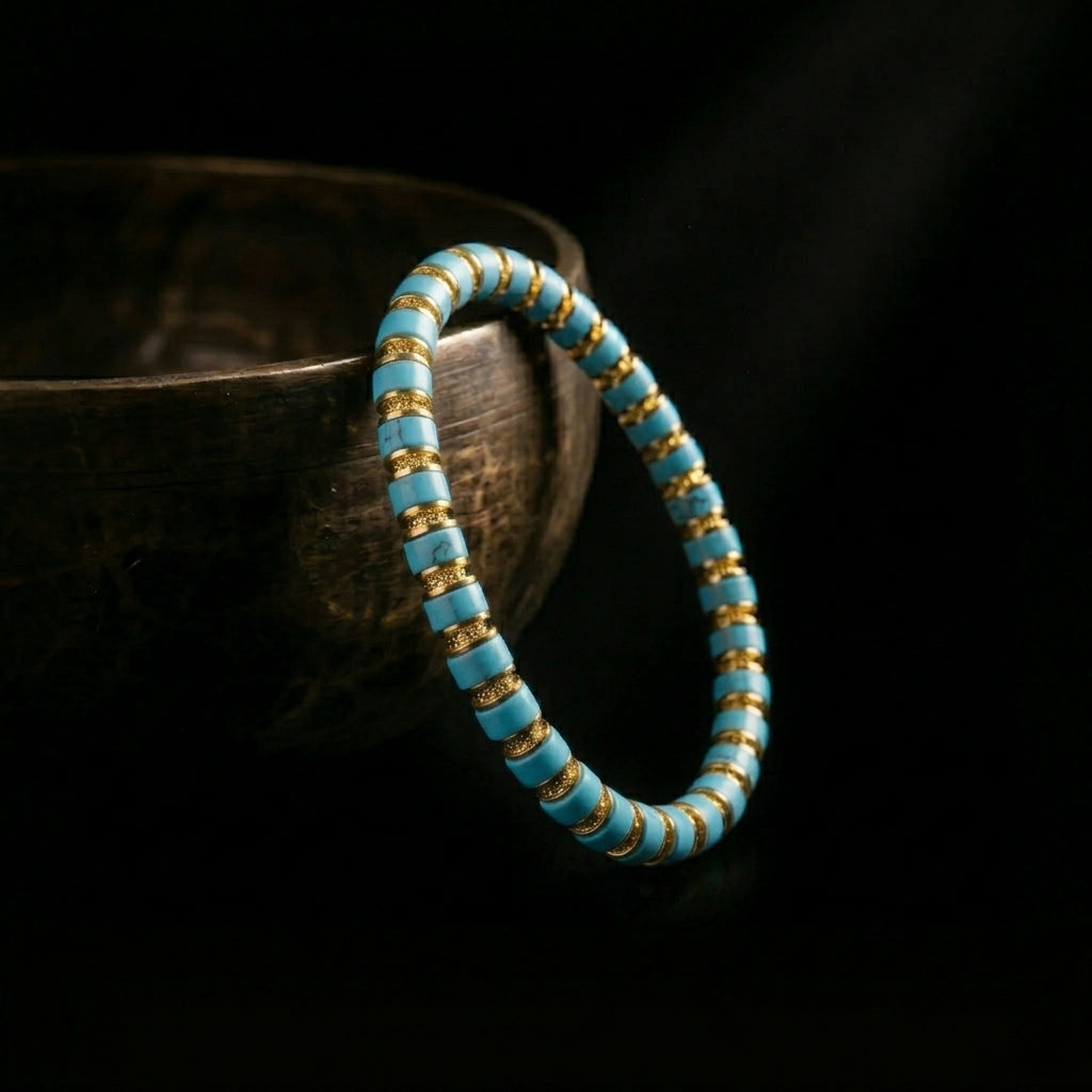 The disc-cut Turquoise grounding bracelet resting beside a traditional singing bowl, capturing the essence of the 1,900-meter acoustic purification.