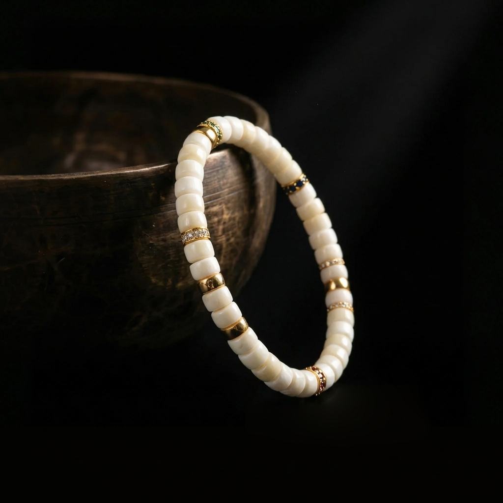 Ethically shed antler focus bracelet draped over a dark rustic bowl, highlighting its organic texture and modern eastern aesthetic.