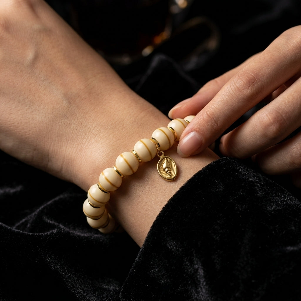 A person rubbing the textured surface of the Bodhi seed bracelet, using the organic beads to absorb restless energy and gradually develop a rich patina.