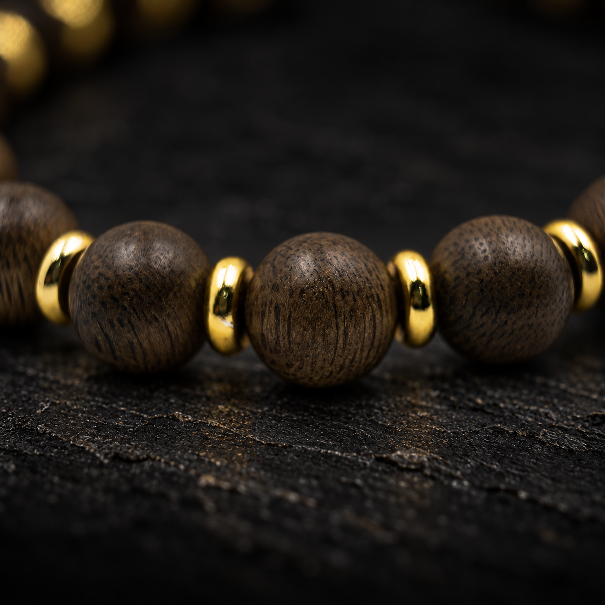 DAIWEI Agarwood Bracelet – close-up detail on black slate background
