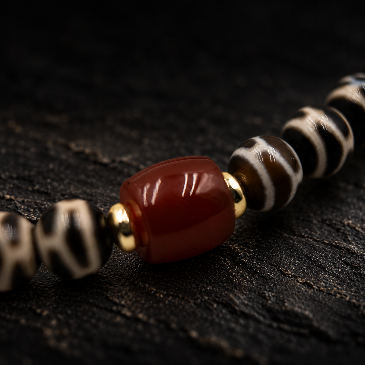 LUSHU Patterned Agate Bracelet – close-up detail on black slate background