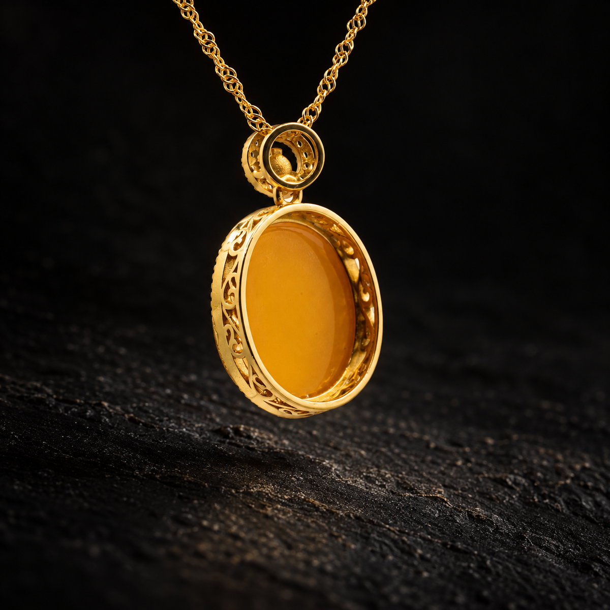 QINGJI Oval Amber Necklace – close-up detail on black slate background