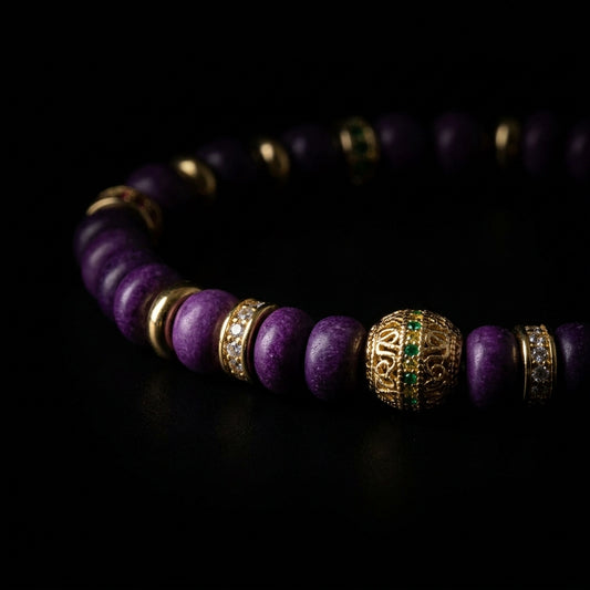 Close-up of the Sugilite boundary bracelet, featuring 6mm disc-cut deep violet stones, clear crystal pavé spacers, and an ornate gold filigree focal node with green pavé accents.