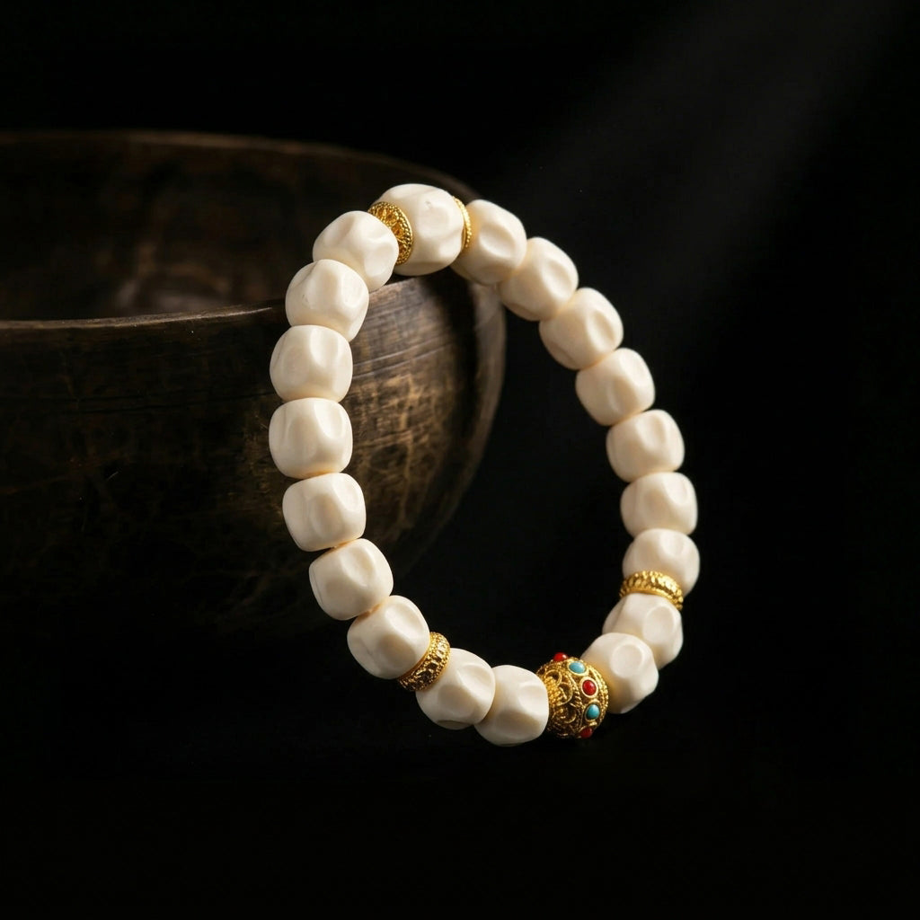 Jambhala organic shed antler mindfulness bracelet resting on an ancient singing bowl, prepared for the 1,900-meter sound purification ritual for grounding.