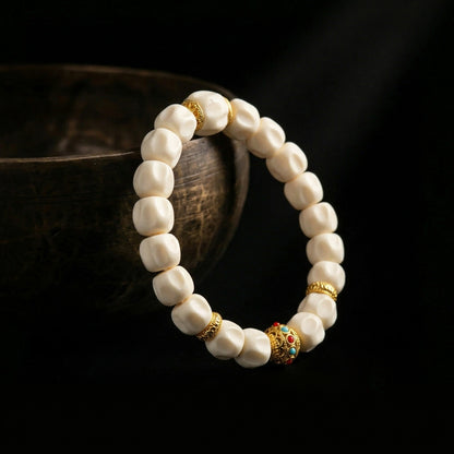 Jambhala organic shed antler mindfulness bracelet resting on an ancient singing bowl, prepared for the 1,900-meter sound purification ritual for grounding.