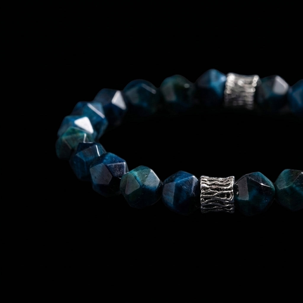 Close-up of the faceted Turquoise calming bracelet, featuring deep blue geometric stones and silver-toned oxidized artisan metal accents with bark texture.