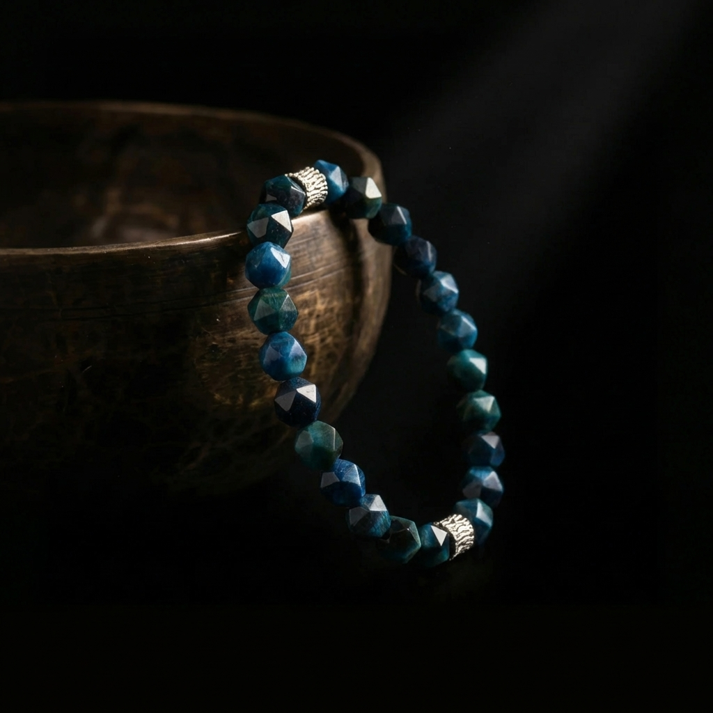 Jambhala deep blue faceted Turquoise mindfulness bracelet resting on an ancient singing bowl, prepared for the 1,900-meter sound purification ritual.