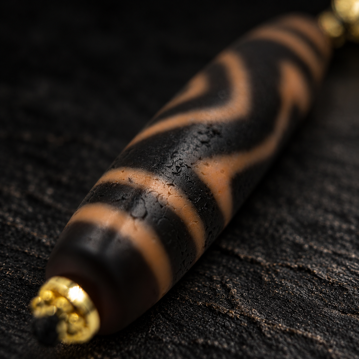 XIEZHI Dzi Agate Necklace – close-up detail on black slate background