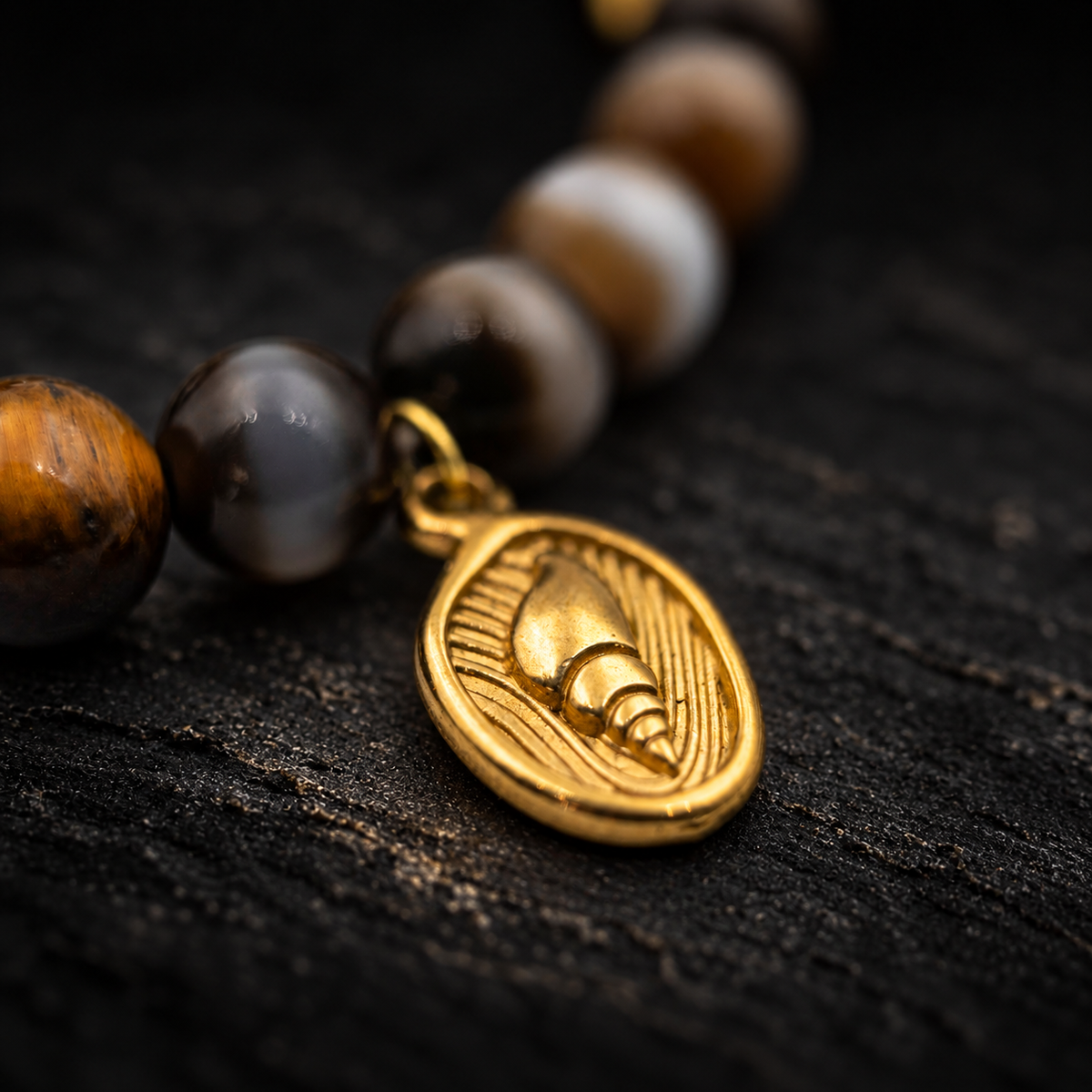 XUANGUI Tiger's Eye Bracelet – close-up detail on black slate background