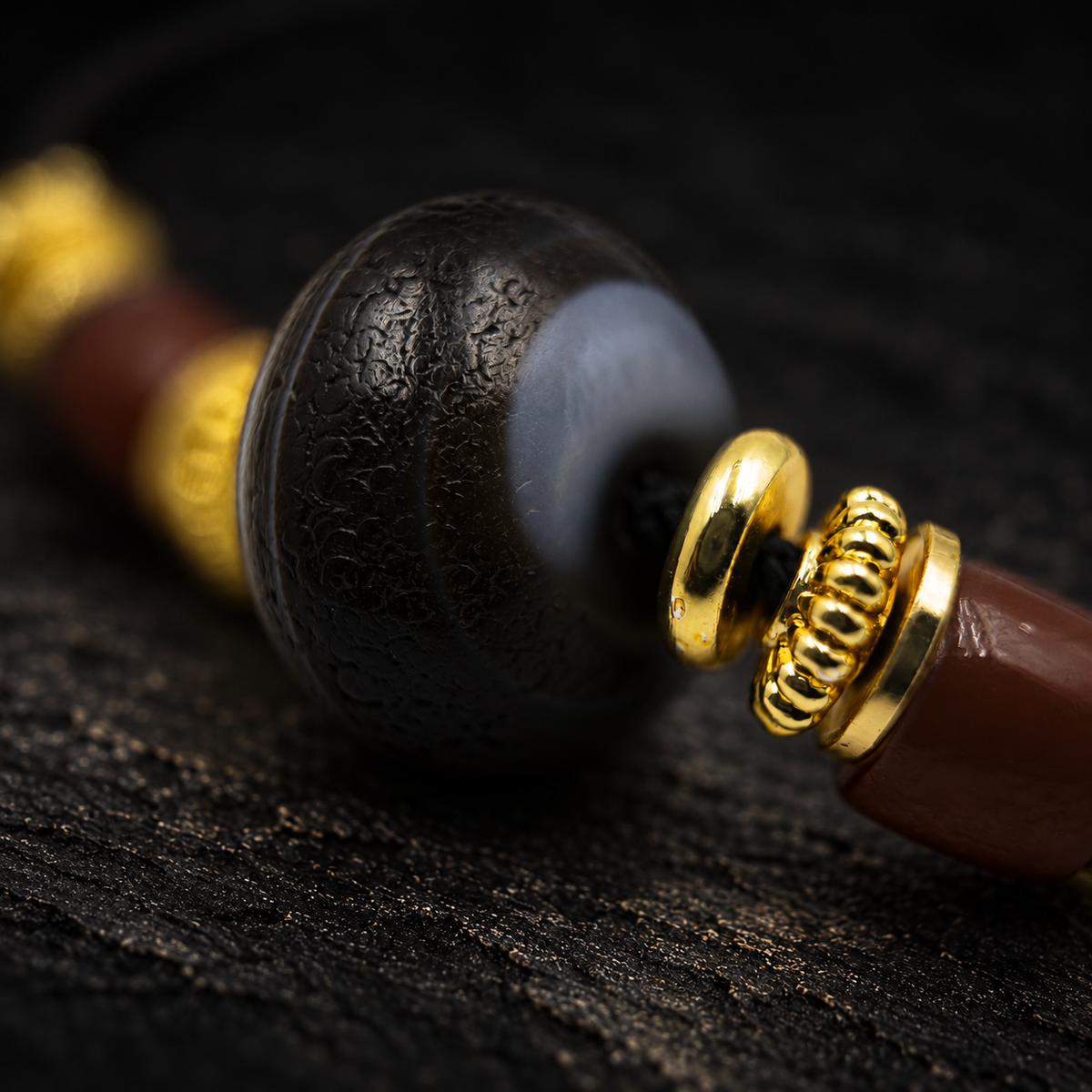 XUANWU Aged Agate Necklace – close-up detail on black slate background