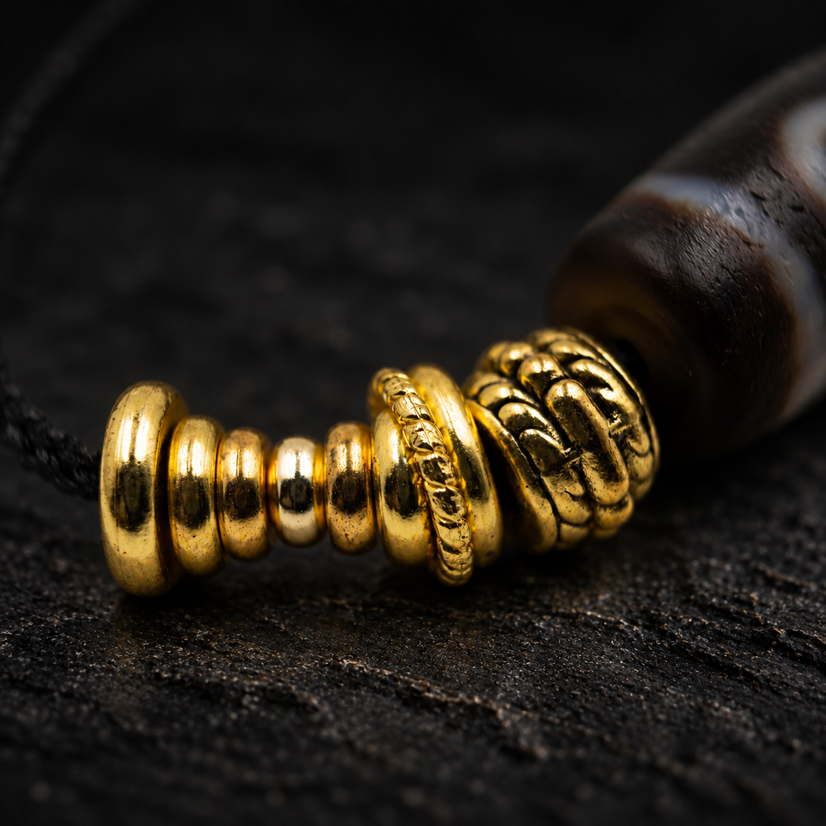 ZHUYIN Dzi Agate Necklace – close-up detail on black slate background