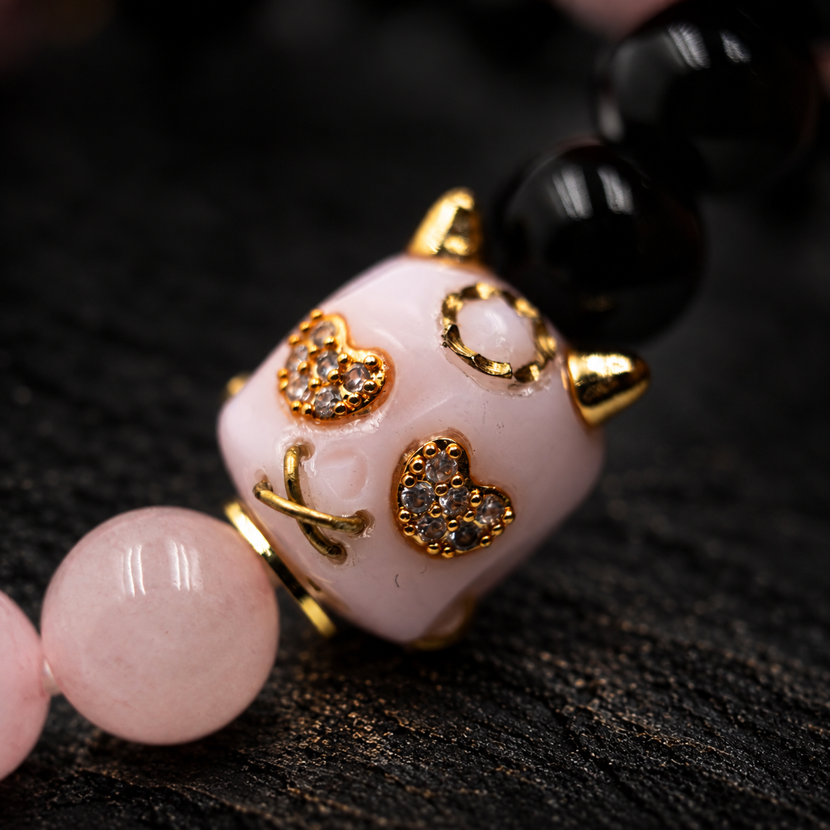 ZOUWU Obsidian & Pink Jade Bracelet – close-up detail on black slate background